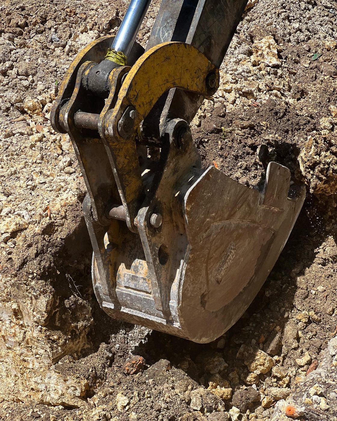 Excavator digging on site