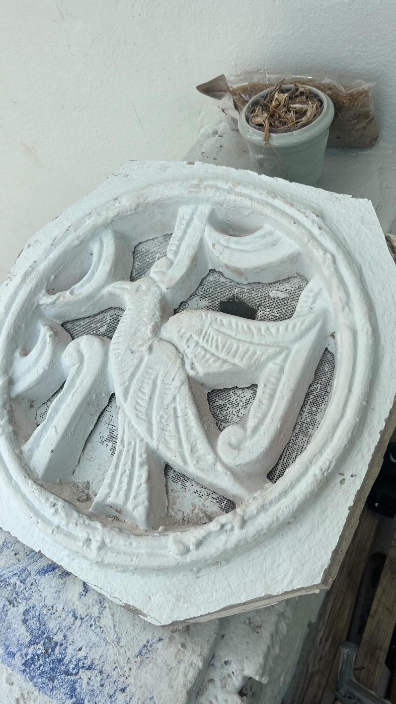 Hand-detailed cast-stone relief